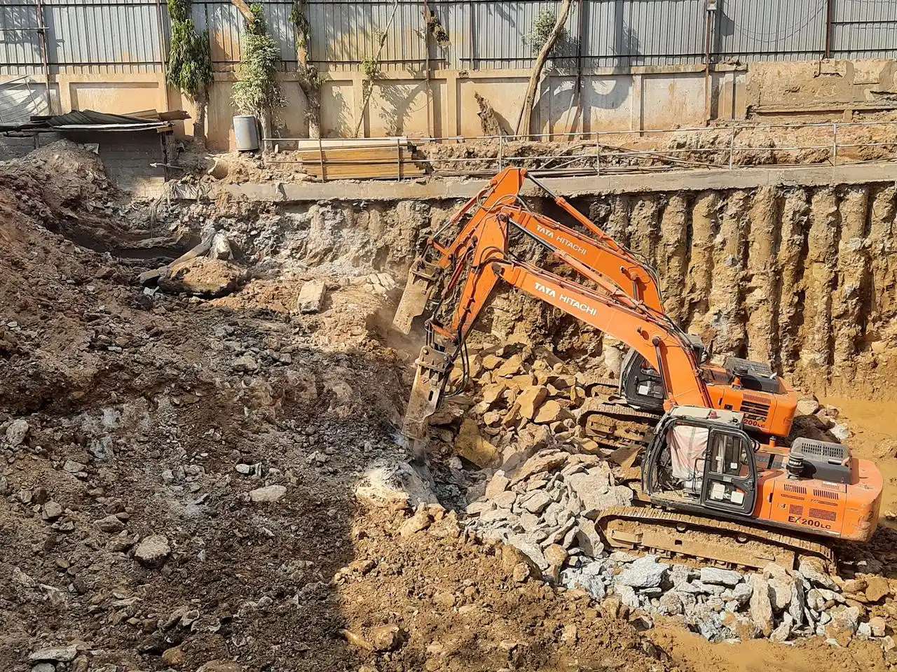 Excavator performing basement excavation work at commercial site in Andheri Mumbai