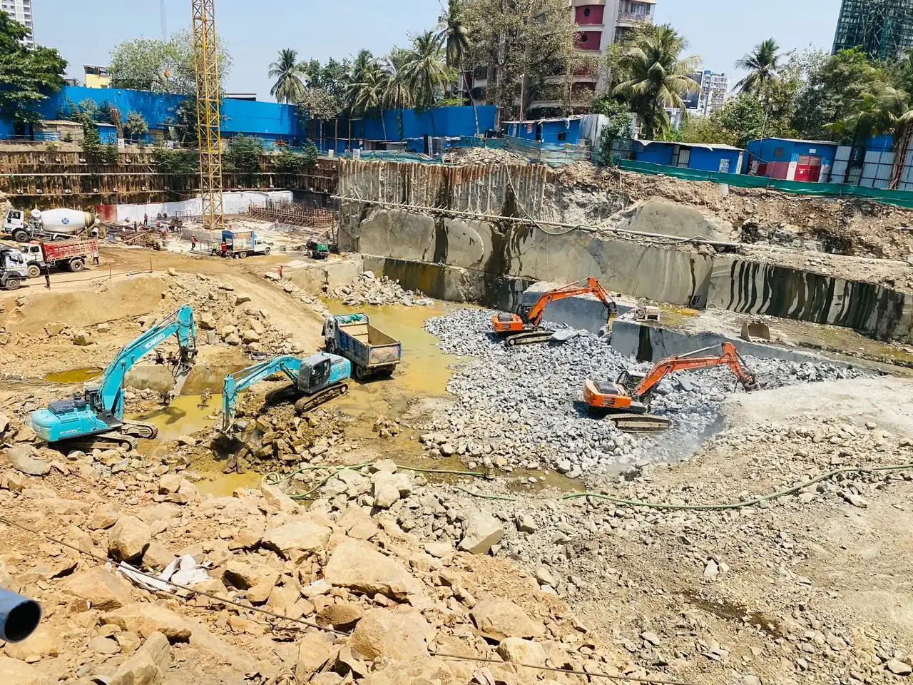 Earthmoving equipment on large infrastructure project in Mumbai for land levelling and site clearing