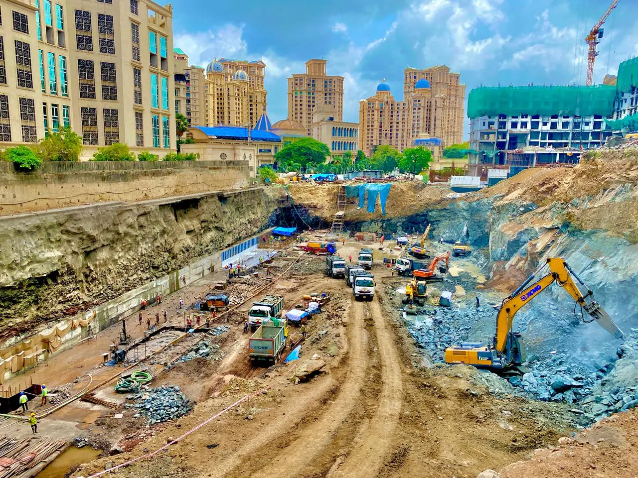 Deep excavation project with JCB and excavator machines at construction site in Powai Mumbai